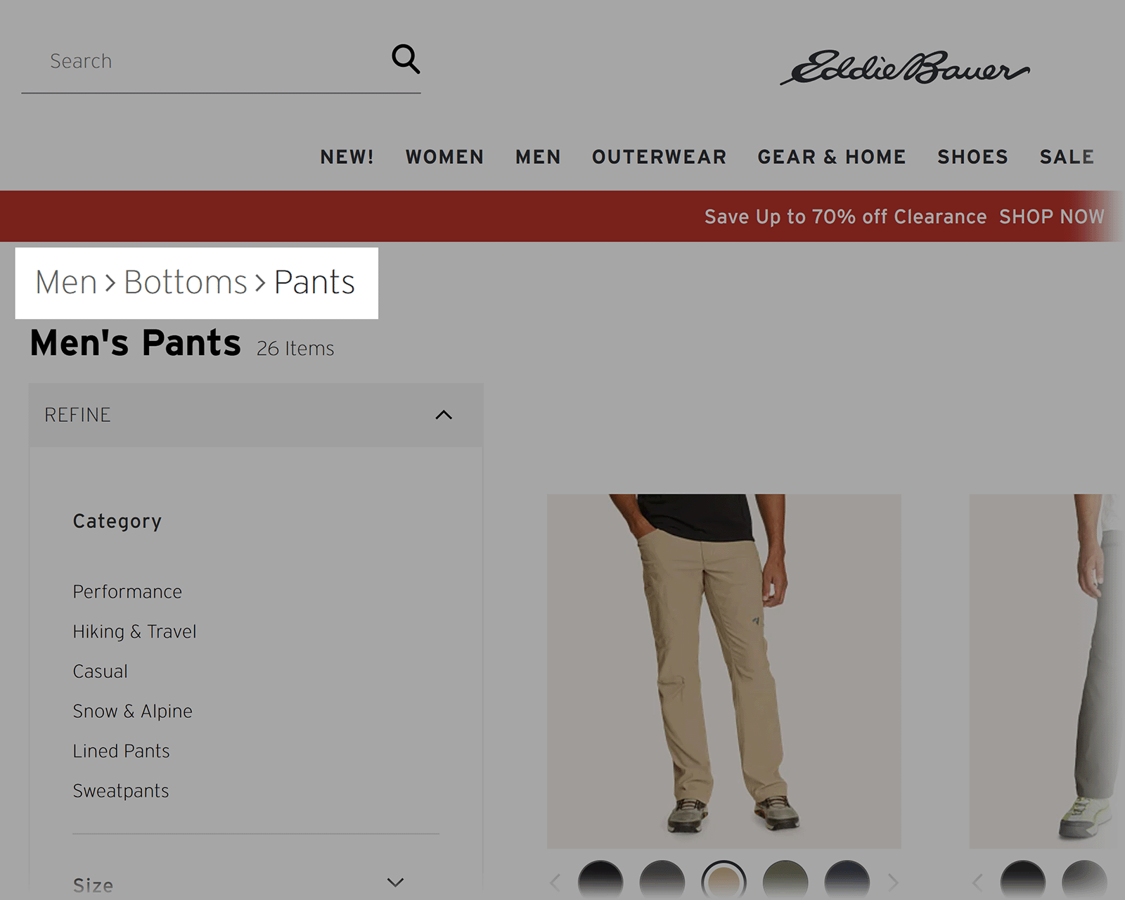 Eddie Bauer men’s pants page showing breadcrumb path Men > Bottoms > Pants above the product list.